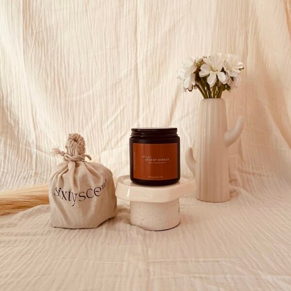 Desert Mirage soy candle inspired by warm desert winds — notes of amber, oud, and vanilla create a soothing, grounded atmosphere for your home