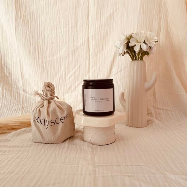 Moonlit Meadow soy candle with soft floral notes of white tea, jasmine, ylang ylang, and lemon — perfect for peaceful evenings