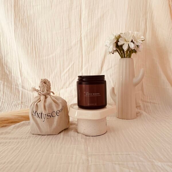 Mystic Woods soy candle with calming blend of amber, oudh, patchouli, and sandalwood for warm, earthy ambiance